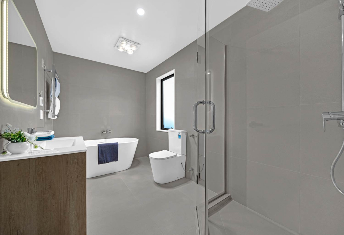 Brandnew 5 beds 4.5 baths house with garage, The ground floor features a private wing with a spacious bedroom, separate bathroom, and its own living area. 13 Star Cross Road, Karaka, Auckland