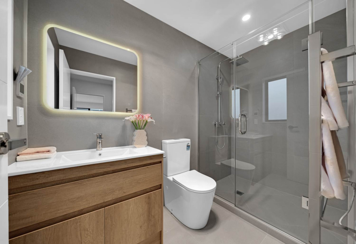 Brandnew 5 beds 4.5 baths house with garage, The ground floor features a private wing with a spacious bedroom, separate bathroom, and its own living area. 13 Star Cross Road, Karaka, Auckland