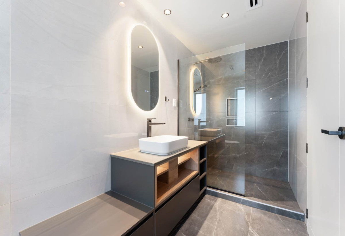Rangitoto College zone, 502m2 section, 502m2 Floor area, 2 kitchens, 5 beds + 2 office room 4.5 baths house with double garage, Located on the basement level, the private gym is complete with a large mirrored feature wall , 18 Hooten Place, Oteha, Auckland
