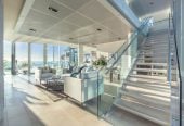 Just 160 metres from Waiake Beach, 1948m2 section, Built-in lift, 5 beds (5 ensuites) + office and wine room 6.5 baths house with 4 garage and the 18-metre cantilevered lap pool, 4 Sharon Road, Waiake, Auckland