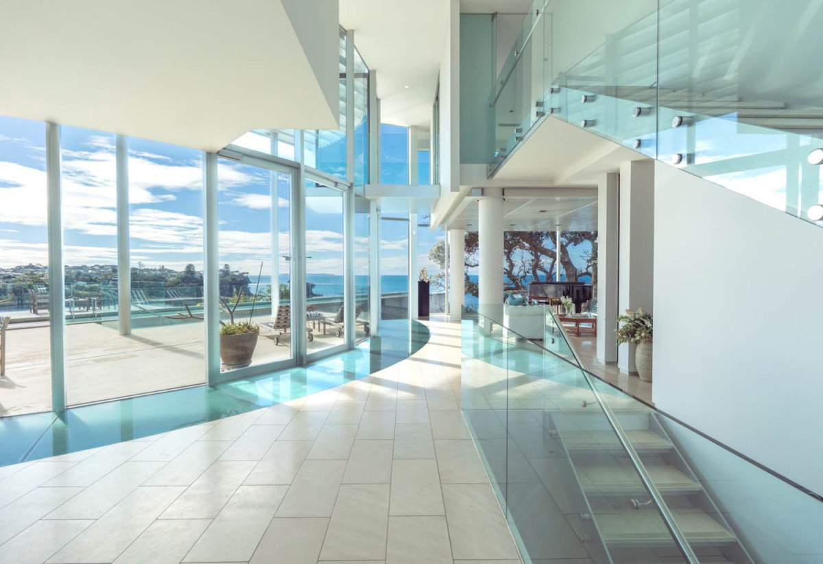 Just 160 metres from Waiake Beach, 1948m2 section, Built-in lift, 5 beds (5 ensuites) + office and wine room 6.5 baths house with 4 garage and the 18-metre cantilevered lap pool, 4 Sharon Road, Waiake, Auckland