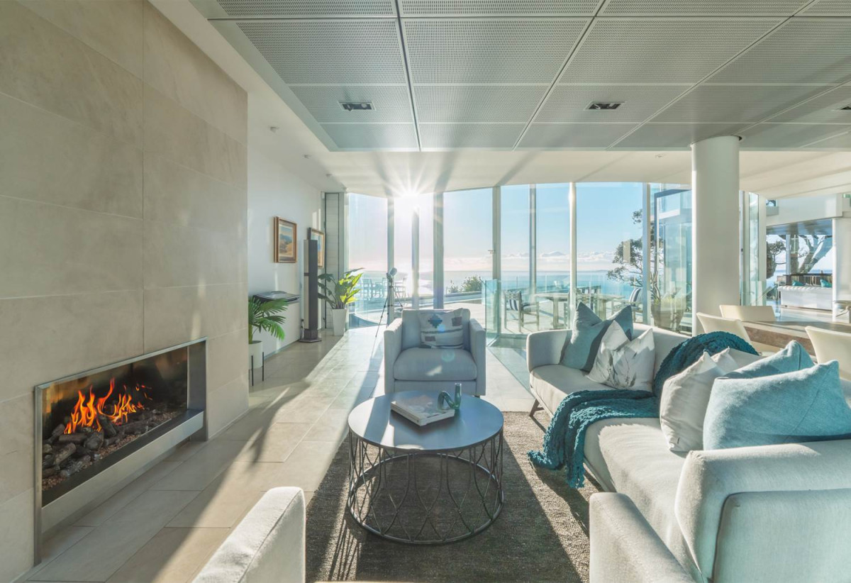 Just 160 metres from Waiake Beach, 1948m2 section, Built-in lift, 5 beds (5 ensuites) + office and wine room 6.5 baths house with 4 garage and the 18-metre cantilevered lap pool, 4 Sharon Road, Waiake, Auckland
