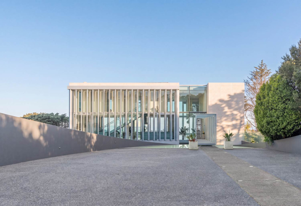 Just 160 metres from Waiake Beach, 1948m2 section, Built-in lift, 5 beds (5 ensuites) + office and wine room 6.5 baths house with 4 garage and the 18-metre cantilevered lap pool, 4 Sharon Road, Waiake, Auckland