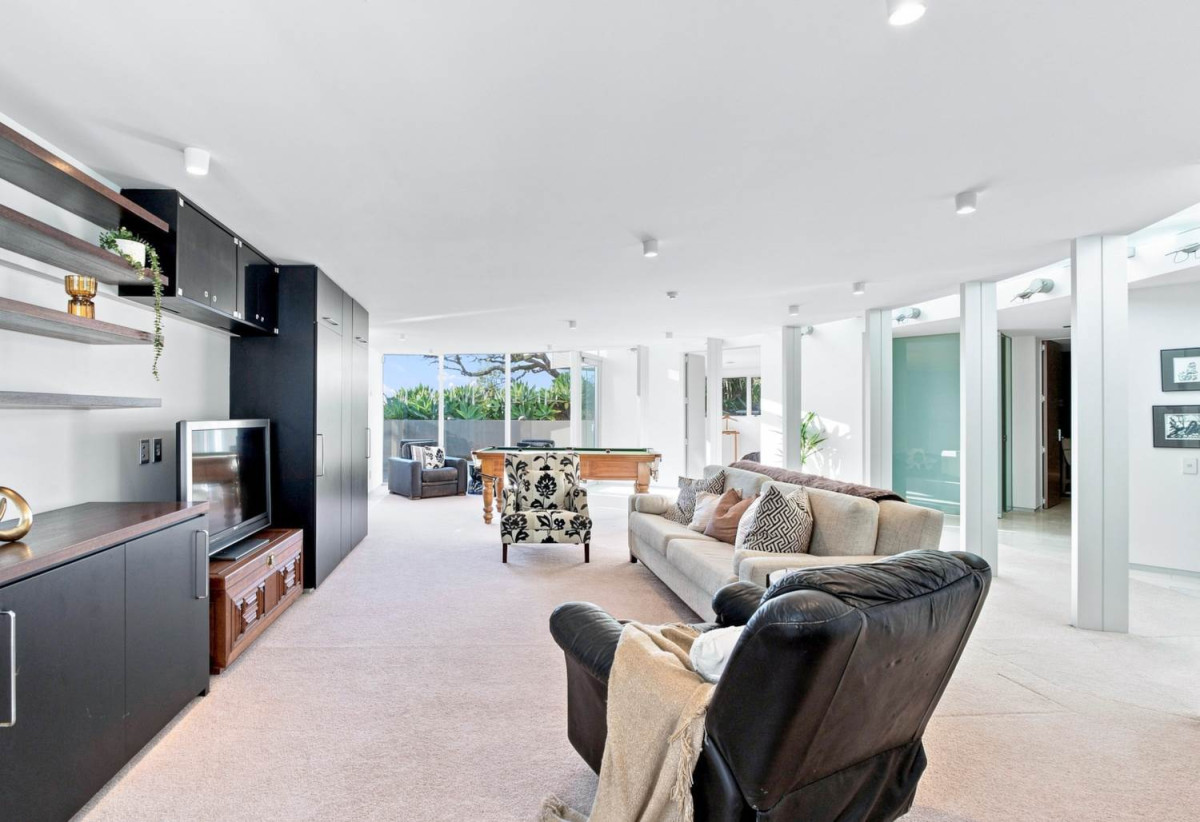 Just 160 metres from Waiake Beach, 1948m2 section, Built-in lift, 5 beds (5 ensuites) + office and wine room 6.5 baths house with 4 garage and the 18-metre cantilevered lap pool, 4 Sharon Road, Waiake, Auckland