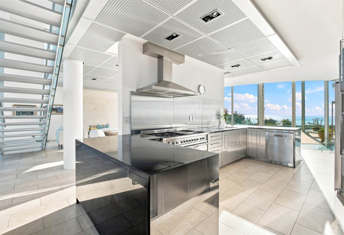 Just 160 metres from Waiake Beach, 1948m2 section, Built-in lift, 5 beds (5 ensuites) + office and wine room 6.5 baths house with 4 garage and the 18-metre cantilevered lap pool, 4 Sharon Road, Waiake, Auckland