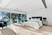 Just 160 metres from Waiake Beach, 1948m2 section, Built-in lift, 5 beds (5 ensuites) + office and wine room 6.5 baths house with 4 garage and the 18-metre cantilevered lap pool, 4 Sharon Road, Waiake, Auckland